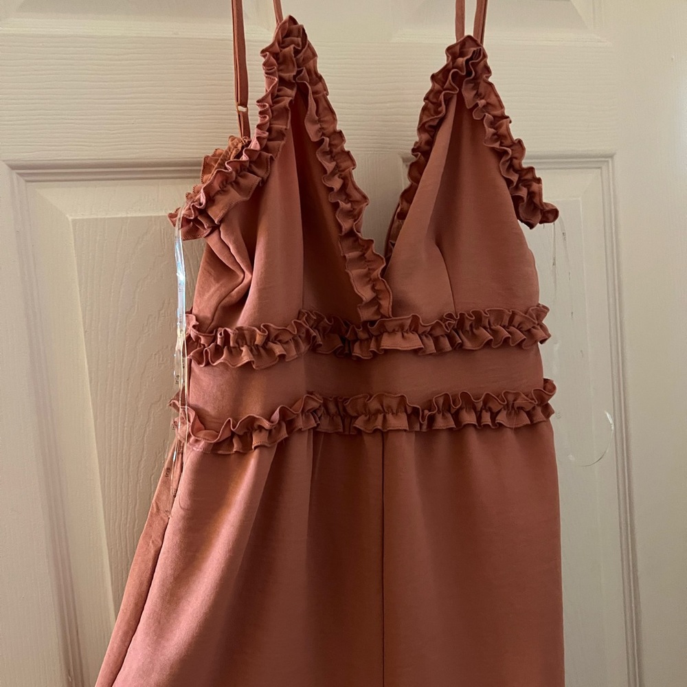 Romper! Never worn! Washed once that’s why tags were removed !